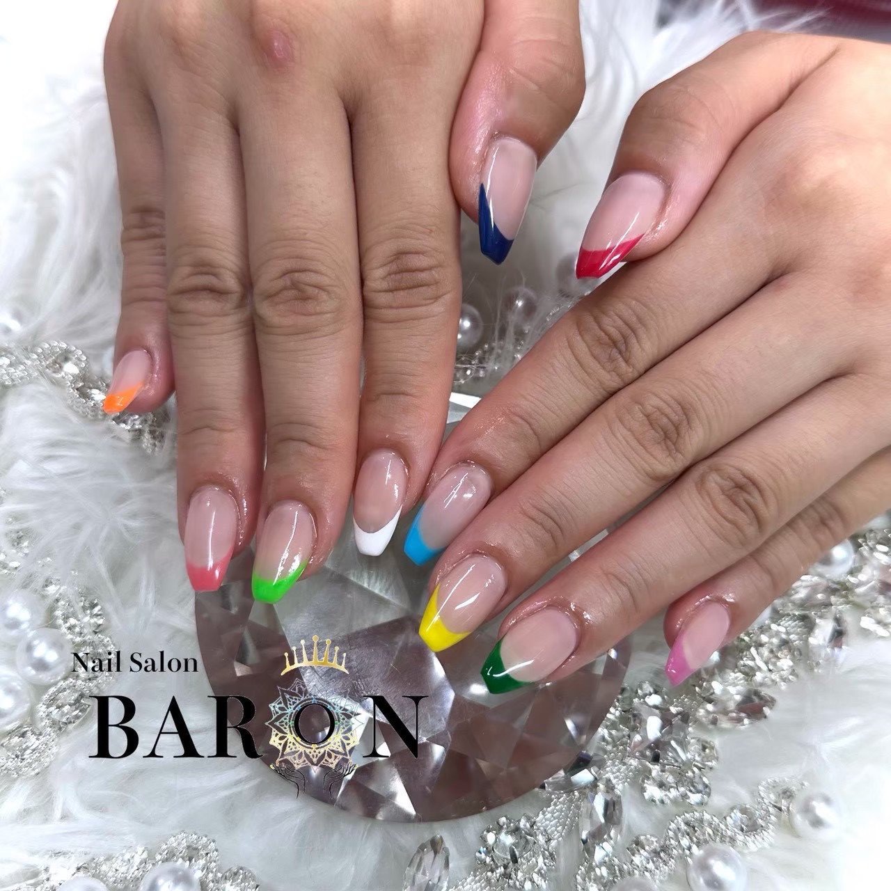 BARON gel nail design with a different colored French tip on each finger